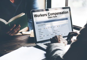 workers compensation on laptop screen 